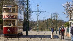 Beamish, The Living Museum of the North, was the 2025 winner of the Art Fund Museum of the Year. An outdoor scen at the Museum, showing a visitor admiring an old fashioned bus.