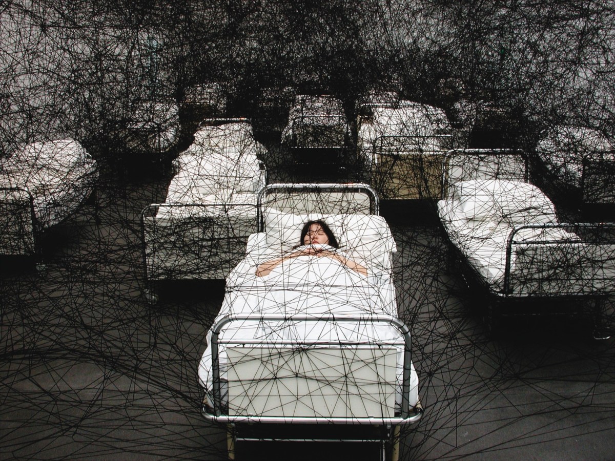 Chiharu Shiota, During Sleep, 2002. Performance view, Kunstmuseum Luzern, Lucerne, Switzerland. Photo: Sunhi Mang. Courtesy: the artist and DACS, London.