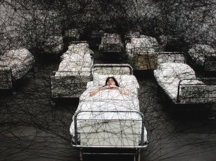 Chiharu Shiota, During Sleep, 2002. Performance view, Kunstmuseum Luzern, Lucerne, Switzerland. Photo: Sunhi Mang. Courtesy: the artist and DACS, London.